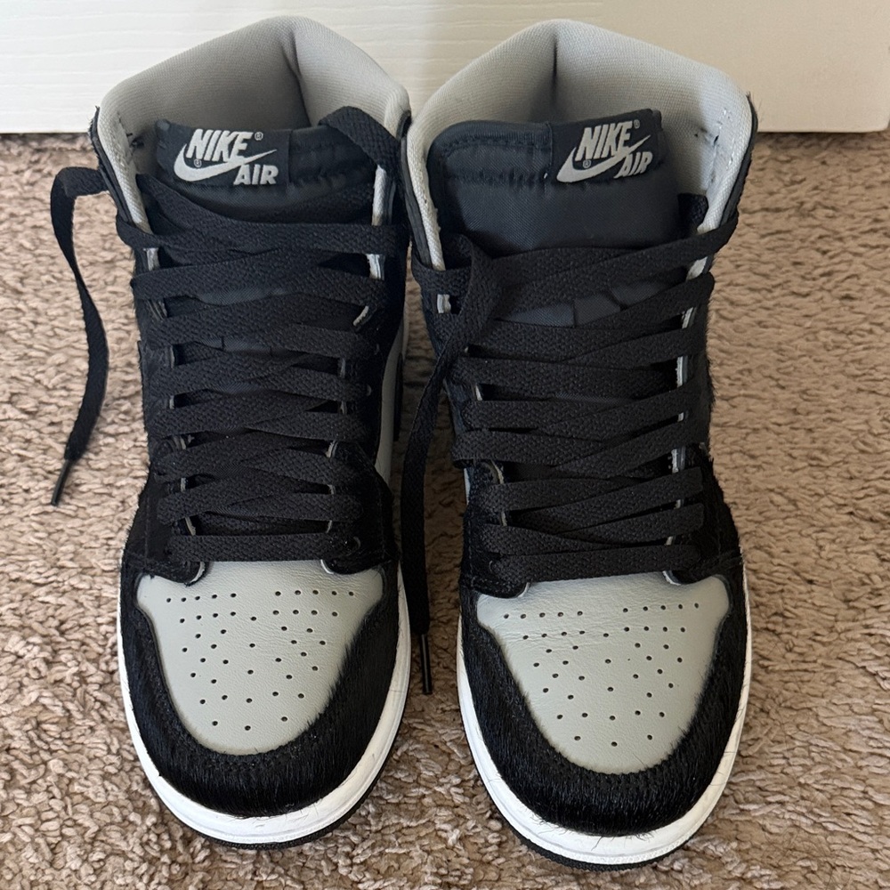 Nike women’s Black and Gray Jordan 1 High-Top Sneakers